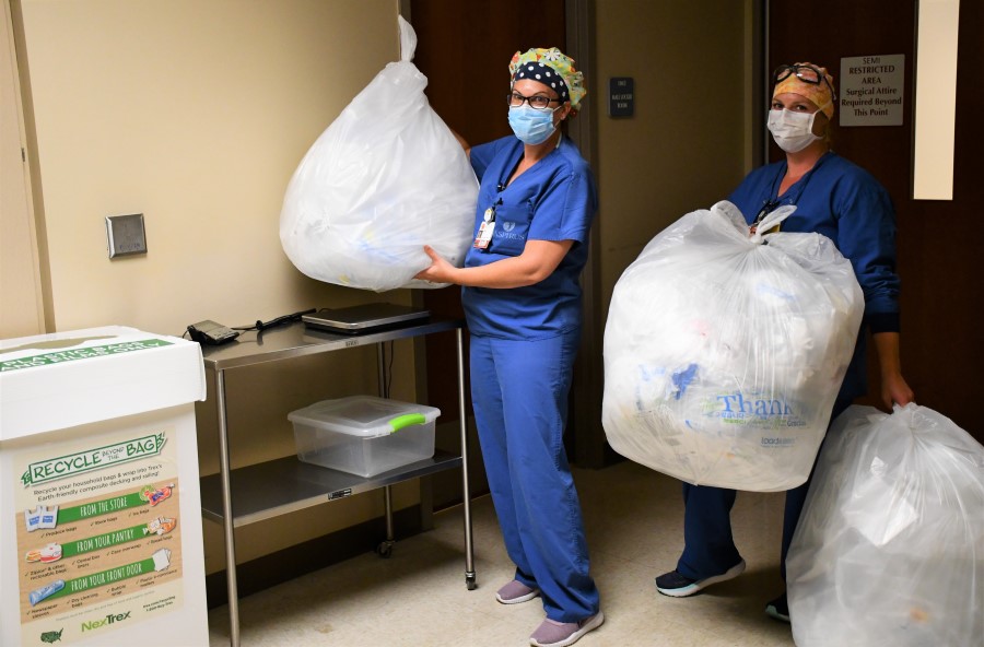 Billie Schilling and Lacey Liske weigh soft plastics recycled at Aspirus Medford Hospital.